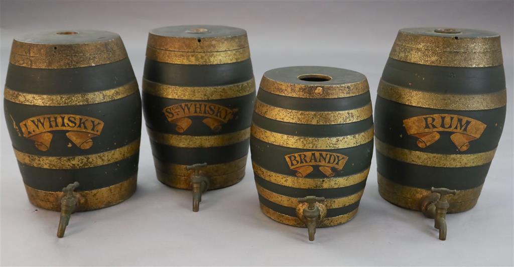 A set of four Victorian painted stoneware spirit barrels, I.Whisky, SCH.Whisky, Rum and Brandy, 14in and 11.5in.